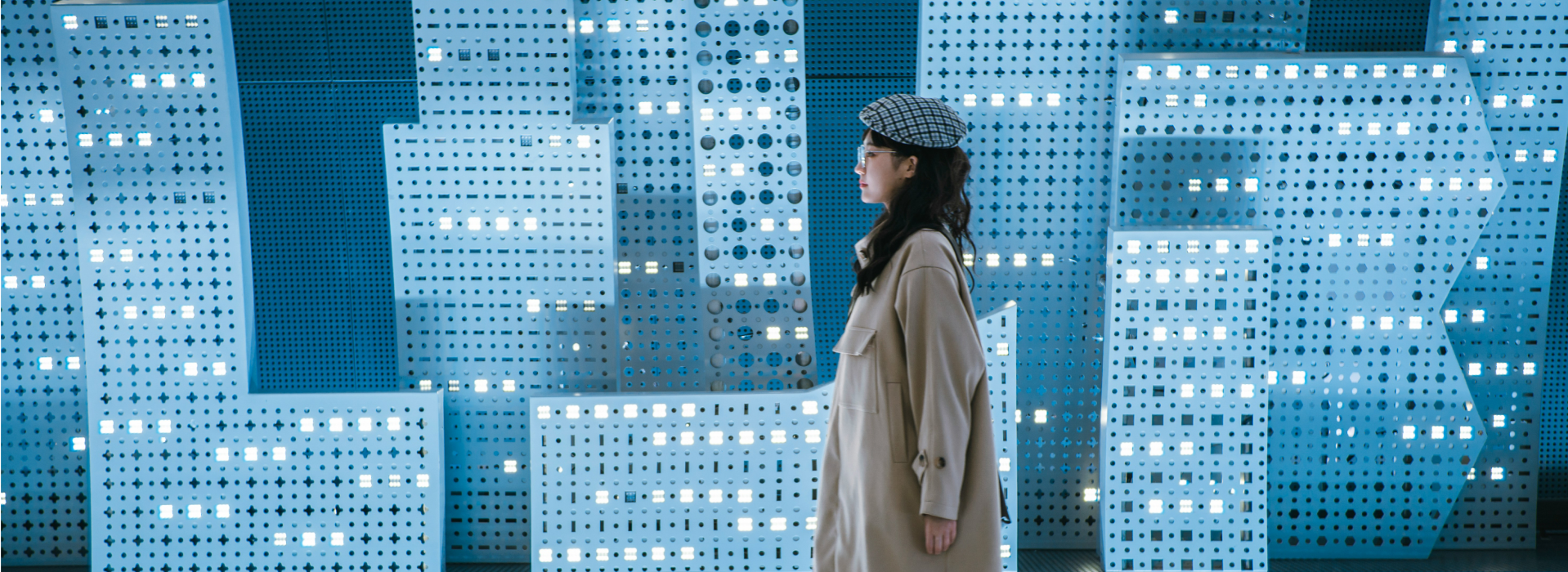 Person standing in front of a blue wall